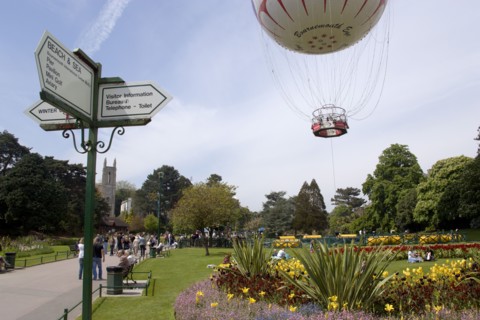 ENGLAND, Dorset, Bournemouth, The Bournemouth Eye balloon lifting off in The Upper Pleasure Gardens