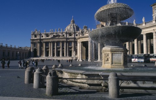 ITALY, Lazio, Rome, St Peter’s exterior with fountain in foreground.