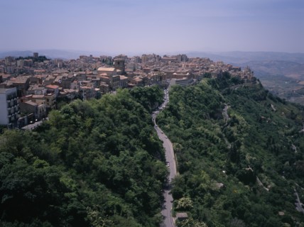 ITALY, Sicily, Enna Province, "A road leading to the city , view West over the rooftops from