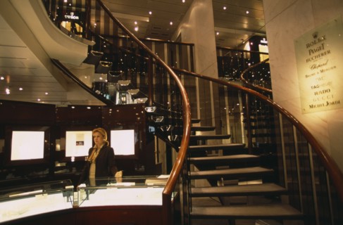 SWITZERLAND, Geneva, Interior of jewellery shop on Rue du Rhone with sales assistant standing