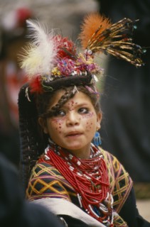 PAKISTAN, North West Frontier Province, Bumburet, "A young Kalash girl in traditional dress at the