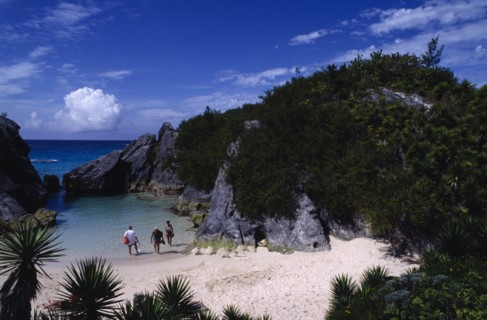 BERMUDA, Jobsons Cove, People in secluded cove with sand beach and seawater pool almost encircled