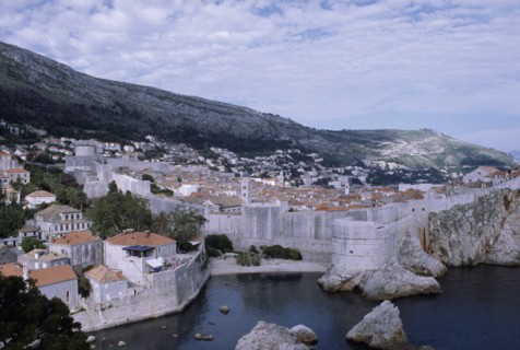 CROATIA, Dalmatia, Dubrovnik, View over the old city rooftops with the enclosed fortified walls