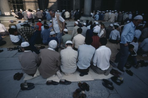 TURKEY, Istanbul, Muslim men and boys at prayer at the Sultan Ahmet Cami or Blue Mosque.