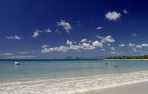 MARTINIQUE, Landscape, Beach, View from the waters edge across calm clear turquoise sea with people