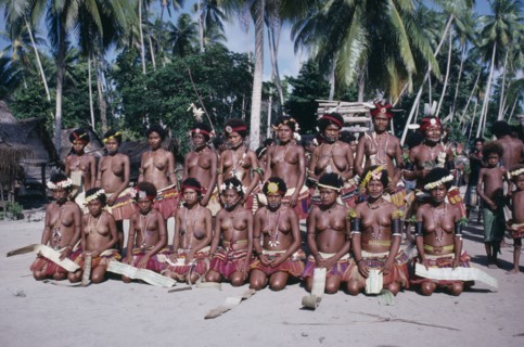 PACIFIC ISLANDS, Melanesia, Trobriand Islands, Kaileuna Island. Female dancers in costume greeting
