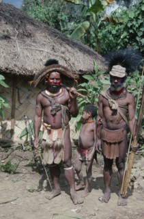 PACIFIC ISLANDS, Melanesia, Papua New Guinea, Southern Highlands.Tari. Huli tribemen with a child