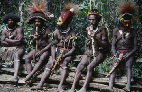PACIFIC ISLANDS, Melanesia, Papua New Guinea, Southern Highlands. Huli tribe men sat together