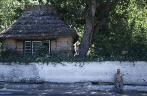 PORTUGAL, Madeira, Camacha, Traditional thatched cottage beside the Largo do Achada the central