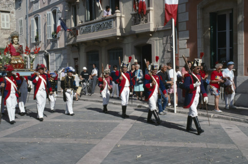 FRANCE, Provence Cote D Azur, Var, Saint Tropez. Bravade Festival with men in costume marching in a