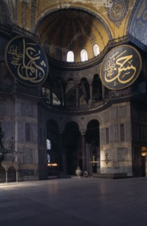 TURKEY, Istanbul, Sultanahmet.  Interior of Haghia Sophia with domed ceiling and decorative mosaic