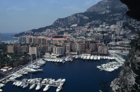 MONACO, Fontvielle, Elevated view over harbour with moored yachts on water towards tall buildings