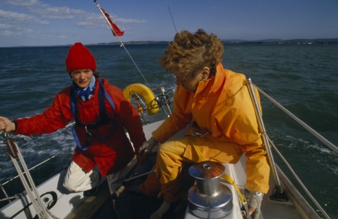 ENGLAND, Dorset, Lymington, Female crew on yacht preparing for trans-Atlantic race.