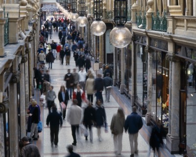 ENGLAND, Yorkshire, Leeds, Leeds County Arcade interior with shoppers walking along marbled walkway