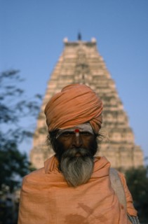 INDIA, Karnataka, Hampi, Holy man in front of Virupaksha Temple in the ancient city of Vijayanagar