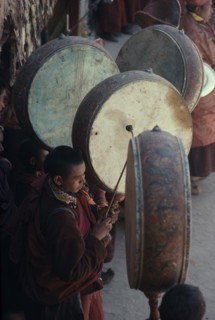 INDIA, Ladakh, "Buddhist musicians playing large, flat monastic drums."