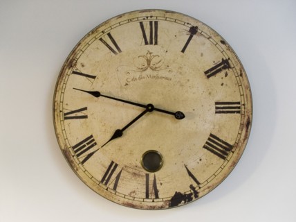 FRANCE, Deux Sevres Region, Poitiers, A classic clock face with Roman numerals against a plain