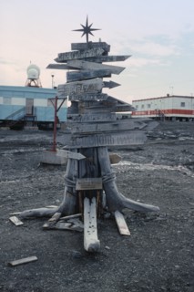 ANTARCTICA, King George Island, Russian Bellingshausen Station. Wooden sign post with star on top