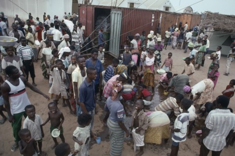 LIBERIA, War, People displaced by civil war attempting to recover cooking oil spilt in queue for UN