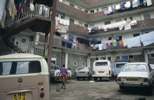 KENYA, Mathare Valley, Nairobi, Middle class housing close to slum area with washing hanging from