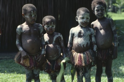 PAPUA NEW GUINEA, Children, Sepik children wearing body paint and grass skirts.