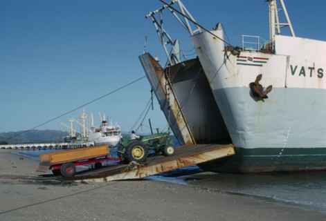 MADAGASCAR, Vohemar, Tractor and trailer on RORO ramp of ship docked in port.