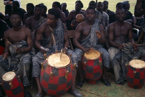 GHANA, Kumasi, Drummers playing at funeral of wife of a chief.