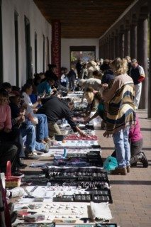 USA, New Mexico, Santa Fe, Native American Pueblo Indian market stalls under the arches of the