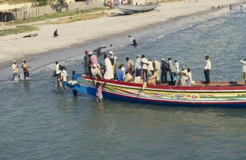 GAMBIA, Banjul, Busy local ferry arriving into shore