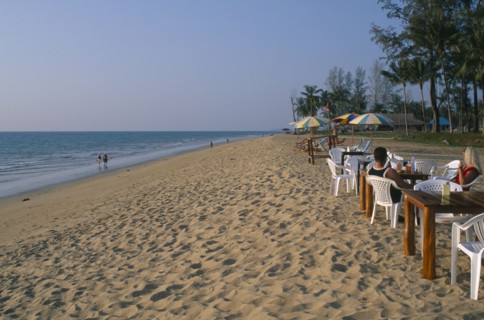 THAILAND, Andaman Sea, Takua Pa district, "Khao Lak, A couple sat at a table on the sandy beach,