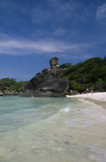 THAILAND, Koh Similan  , Sail Rock, View from the water’s edge of people on the sandy beach and