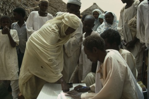 SUDAN, Kordofan Province, Umm Eshera, Signing for sorghum received in food distribution organised