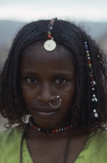SUDAN, North East, Gadem Gafriet Camp, Portrait of Beni Amer Eritrean refugee girl wearing