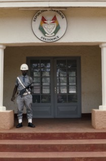 RWANDA, Kigali, Presidential building La Presidence with armed guard standing outside.