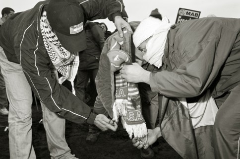 ENGLAND, London, Hyde Park, Islamic protesters burn North American paraphanalia during the One