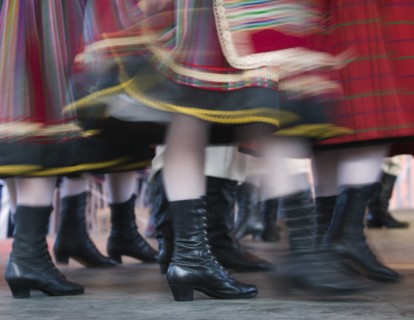 POLAND, Warsaw, "Detail of traditional dancers' costumes performing in the Old Town. Moving,