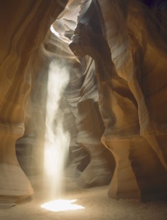 USA, Arizona, Antelope Canyon, Sunshine rays shining through a hole in the slot canyon