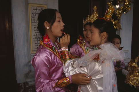 MYANMAR, Mandalay, Funeral dancers putting on make up at the funeral for an Abbot at the Endawya