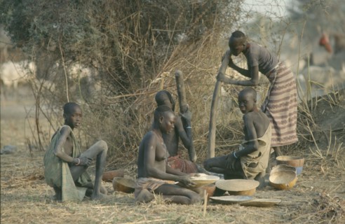 SUDAN, Agriculture, Dinka women pounding millet.