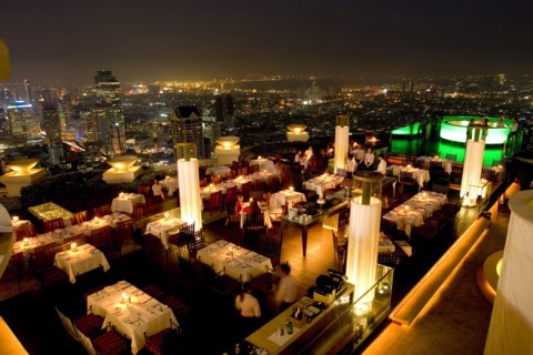 THAILAND, Bangkok, Sorocco Restaurant. View over people dining at tables lit up with light displays