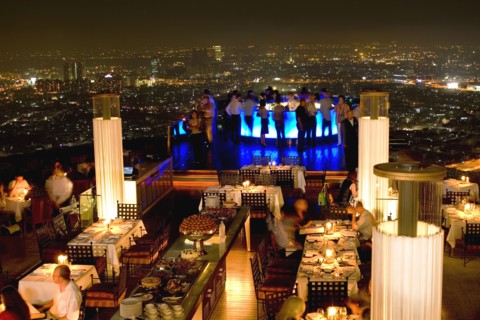 THAILAND, Bangkok, Sorocco Restaurant. View over people dining at tables lit up with light displays