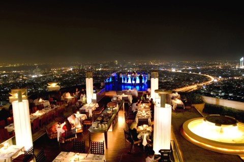 THAILAND, Bangkok, Sorocco Restaurant. View over people dining at tables lit up with light displays