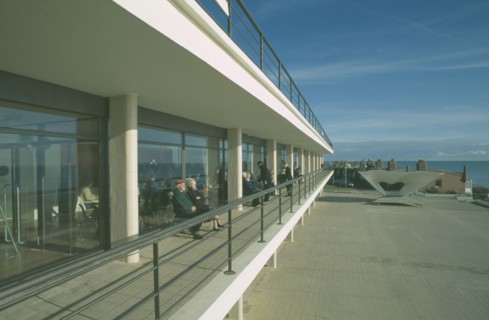 ENGLAND, East Sussex, Bexhill on Sea, De La Warr Pavilion. Exterior view of visitors on balcony