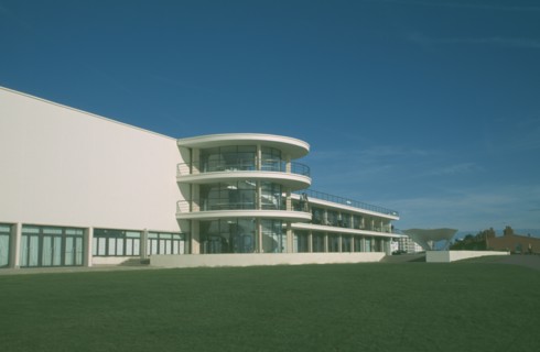 ENGLAND, East Sussex, Bexhill on Sea, De La Warr Pavilion. Exterior view over grass towards back