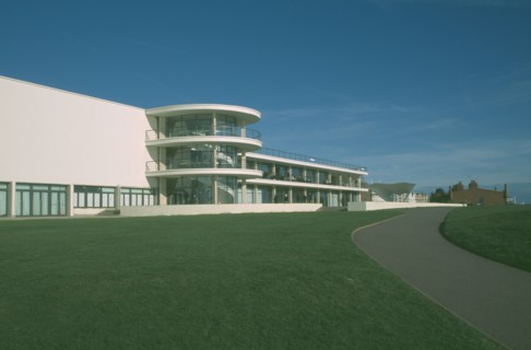 ENGLAND, East Sussex, Bexhill on Sea, De La Warr Pavilion. Exterior view over grass towards back