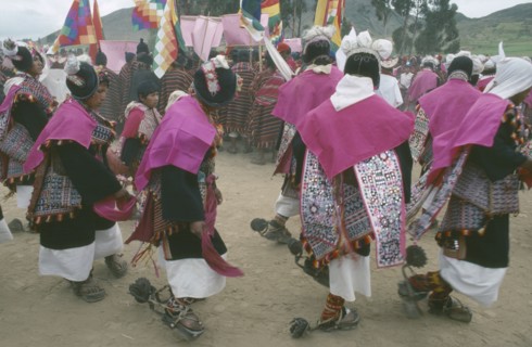 BOLIVIA, Sucre, Tarabuco, Male dancers in costume during Phujllay celebrations.
