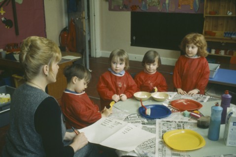EDUCATION, School, Nursery, Nursery School children with teacher gathered around table taking part