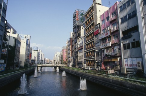 JAPAN, Honshu, Osaka, "Looking east along the Dotonbori River in Minami the city centre theatre,