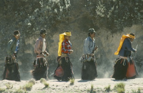 ECUADOR, Pichincha, Cangahua, Men in costume for the Fiesta de San Juan in northern region near