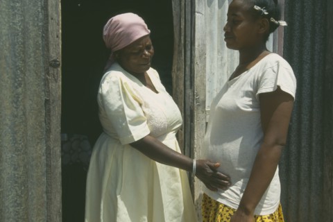 MAURITIUS, Rodrigues Island, Seventy year old traditional birth attendant with thirty five year old